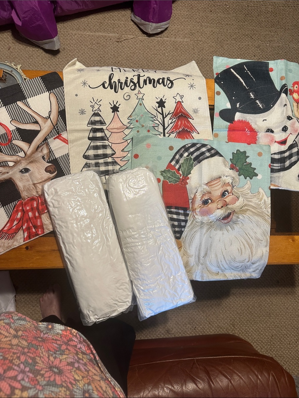 Christmas pillow covers and 3 never opened pillows.